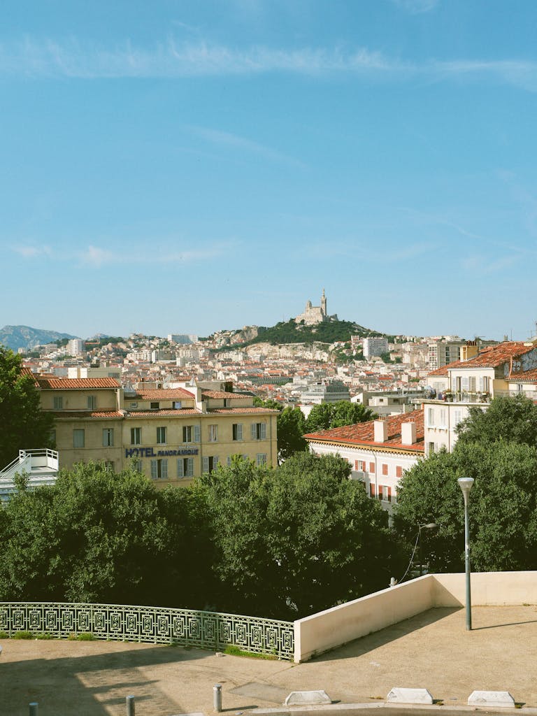 Scenic view of Marseille, France, featuring Notre-Dame de la Garde on a sunny day.